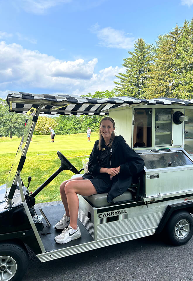 employee on golf cart