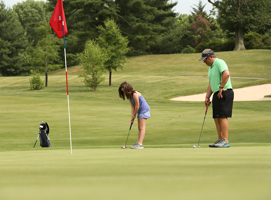 family golfing
