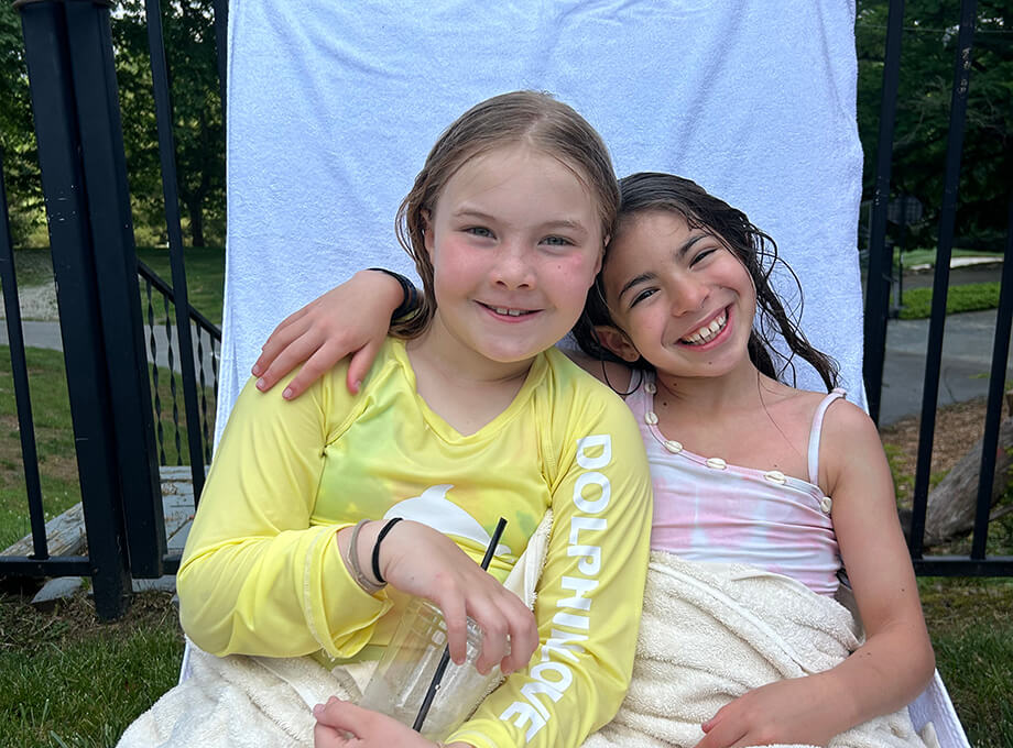 girls on pool chair